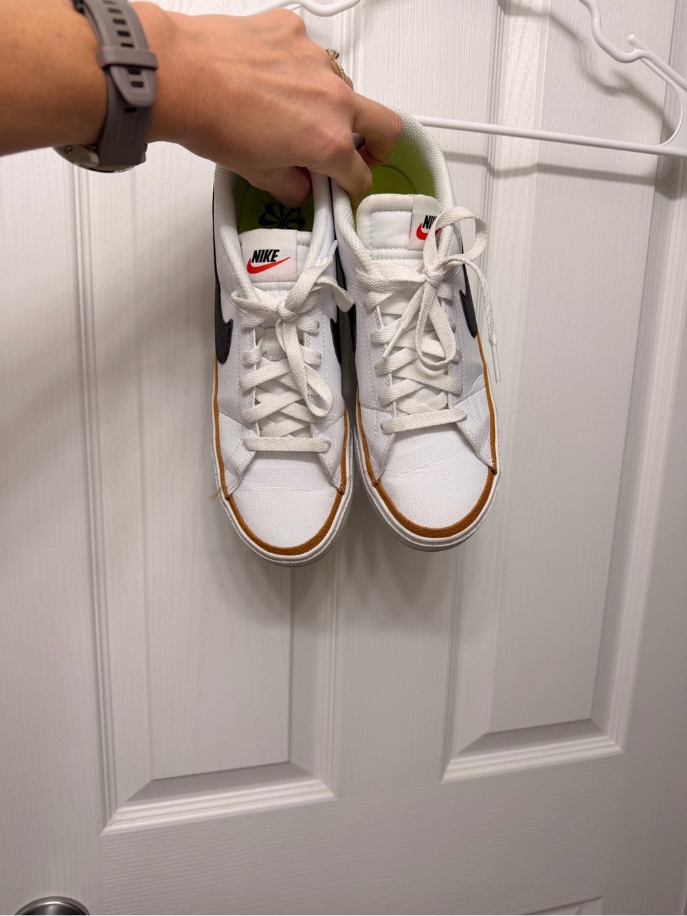 Nike Kids White Sneakers with Brown Trim and Black Swoosh